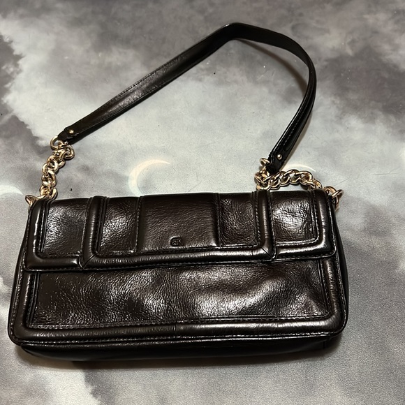 Sleek black faux leather Banana Republic purse with gold accents. - Picture 3 of 4